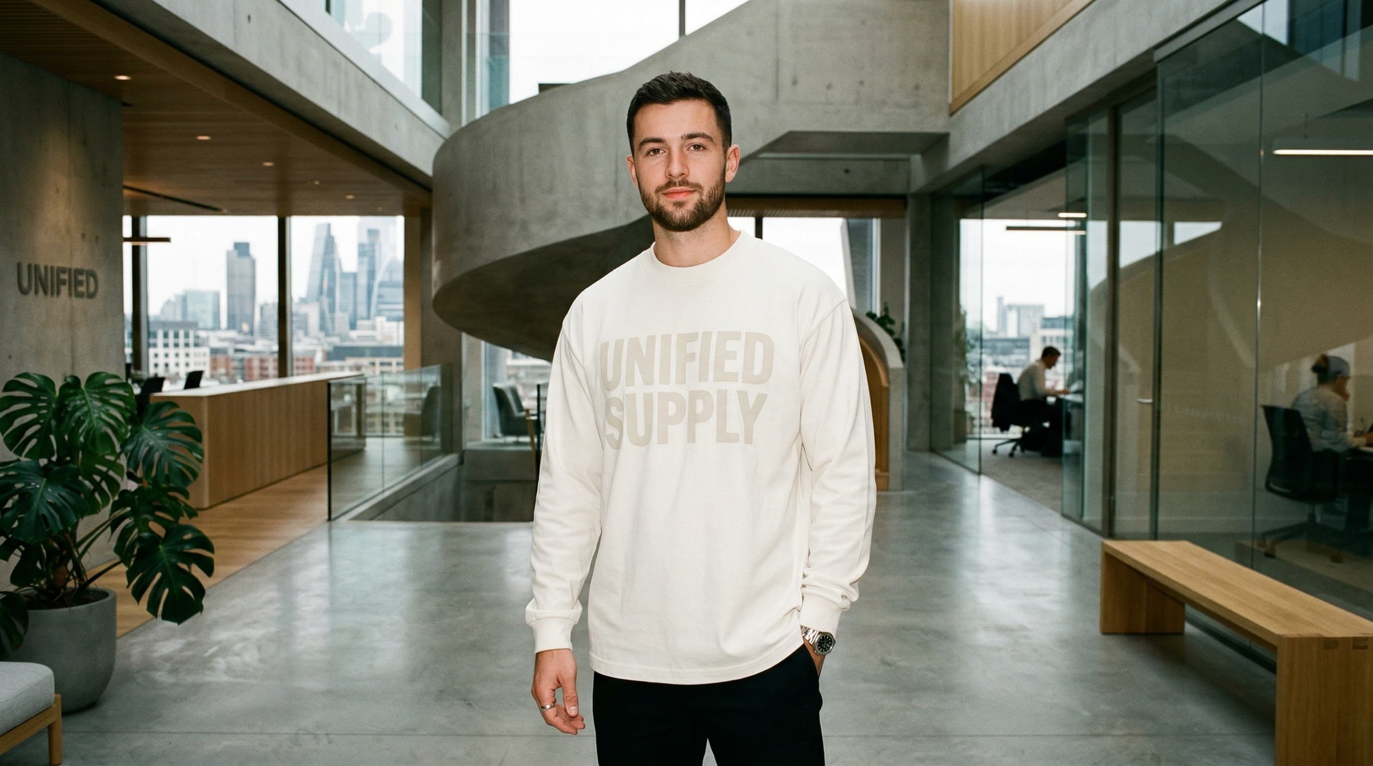 Professional wearing branded merch in a modern office — enterprise company apparel